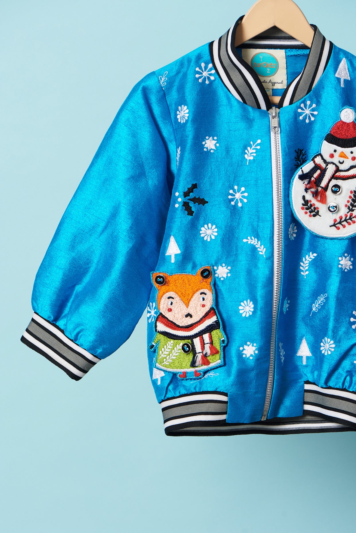 Blue snowman embroidered bomber jacket